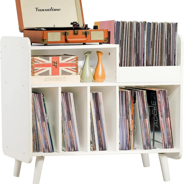 Vinyl record storage cabinet with records, vintage suitcase, and decorative vases