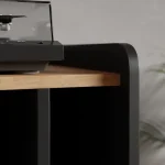 Vinyl record storage cabinet with turntable on wooden top surface