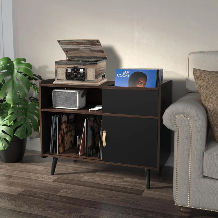 Vinyl record storage cabinet with records, vintage turntable, and speaker in a cozy living room setting